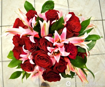 Red roses, lilies and greens delivered to Novosibirsk
