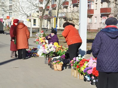 Russian babushkas selling flowers from their gardern