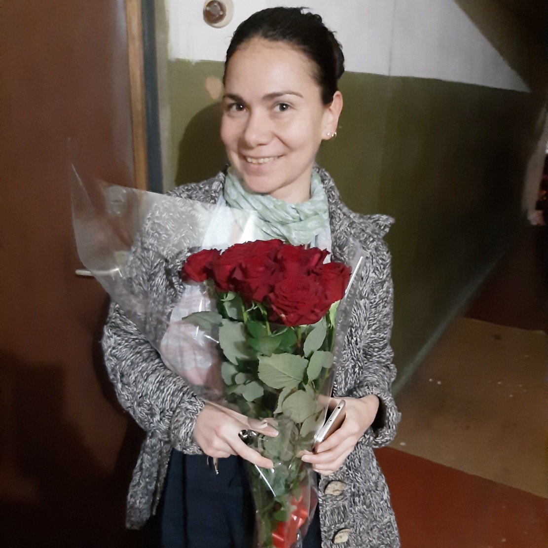 Happy recipient of flowers in Russia